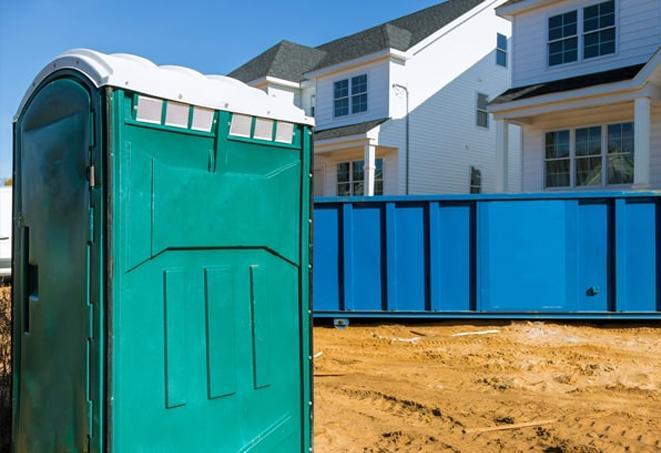 row of portable toilets providing essential facilities at a job site